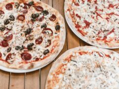 pizza on brown wooden table