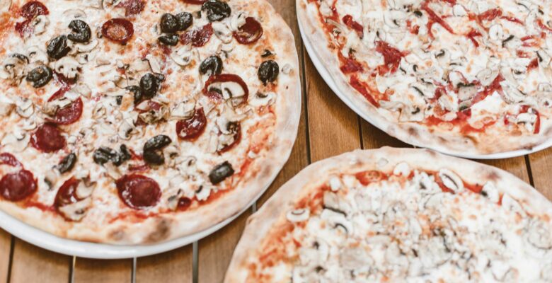 pizza on brown wooden table