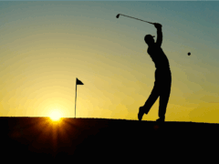 silhouette of man playing golf during sunset