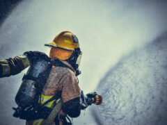 fireman holding fire hose