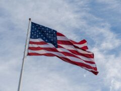 photo of an american flag under the sky