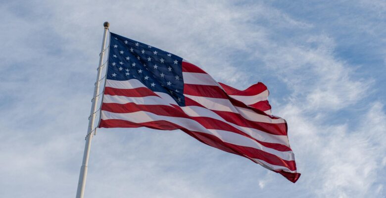 photo of an american flag under the sky