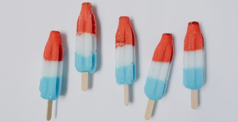red white and blue bomb popsicles in close up photography